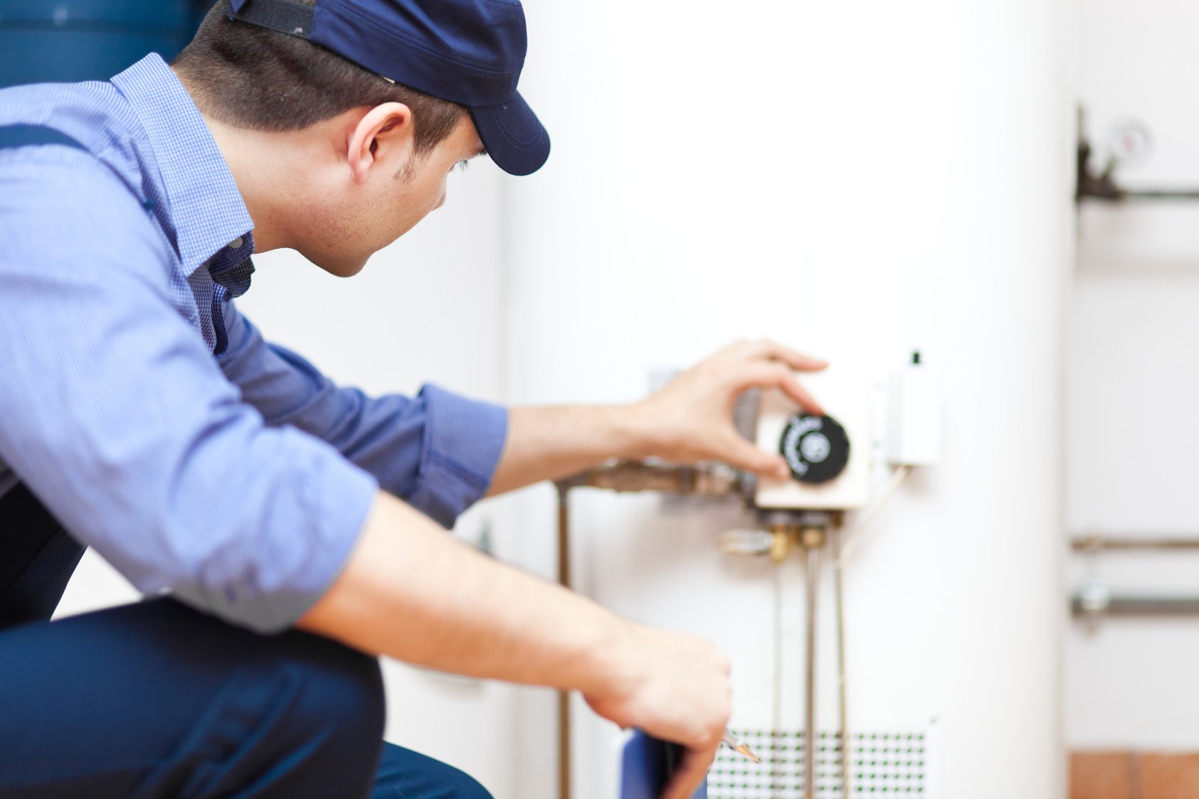 Plumber Repairing an Hot-Water Heater